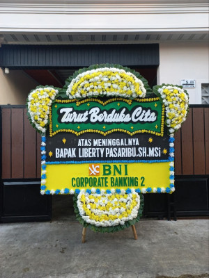 Papan Bunga Duka di Tanah Baru