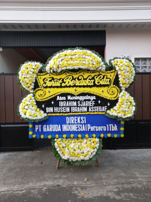 Papan Bunga Duka di Tanah Baru
