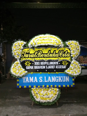 Papan Bunga Duka di Tanah Baru