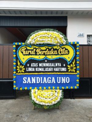 Papan Bunga Duka di Tanah Baru