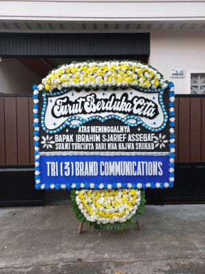 Papan Bunga Duka di Tanah Baru